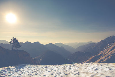 Scenic view of mountains against sky during sunset