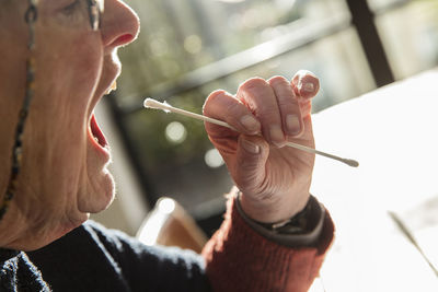 Close-up of woman holding hand