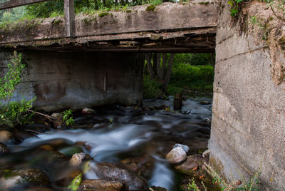 River flowing through bridge