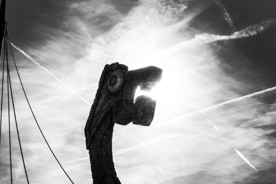 Low angle view of statue against sky