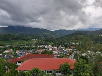 High angle view of townscape and mountains against sky