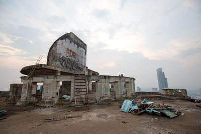 Abandoned building against sky