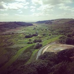 Scenic view of landscape against cloudy sky