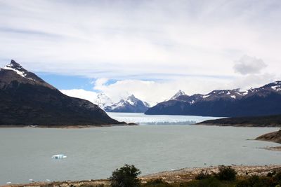 Scenic view of lake against cloudy sky