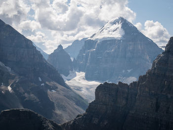 Alpine scenery with huge mountain detail covered by snows,mount st. piran summit, banff, canada