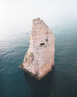 High angle view of rock formation in sea