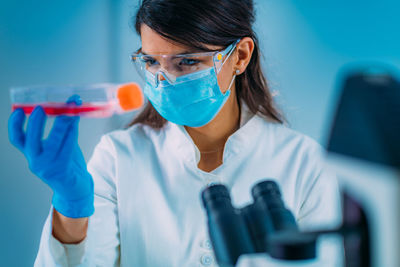 Beautiful female medicine or molecular biology student in laboratory