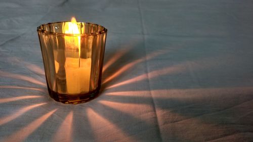 Close-up of illuminated light on table