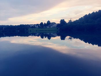 Scenic view of lake against sky during sunset