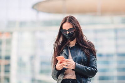 Young woman using smart phone