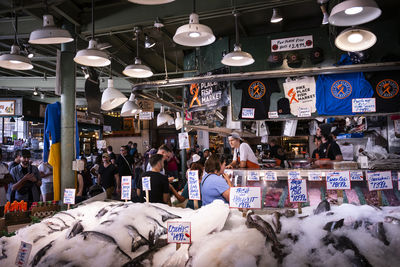 Rear view of people walking in store