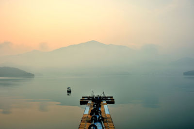 Scenic view of lake against sky during sunset