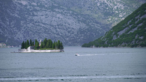 Scenic view of sea against mountain