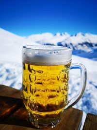 Close-up of beer glass on table