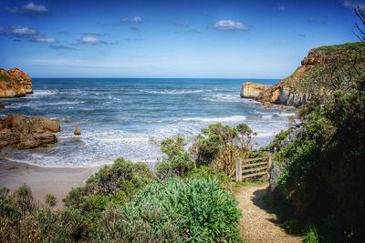 Scenic view of calm sea against blue sky