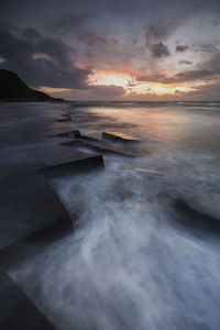 Scenic view of sea against sky during sunset