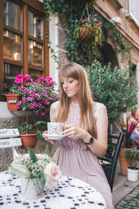 Woman having coffee in cafe