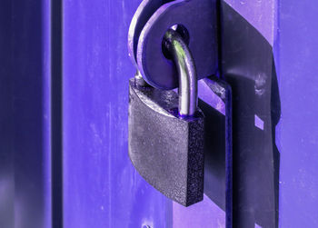 Close-up of padlock on closed door