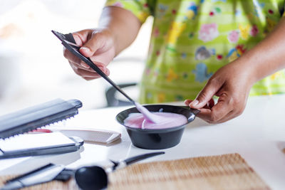 Close-up of hairdressing tools on a wooden table.