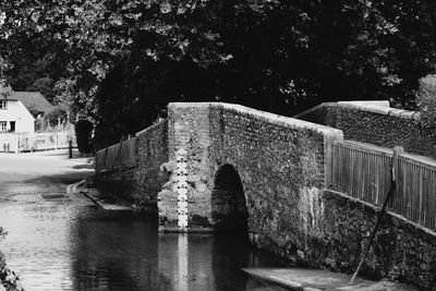 View of bridge over river against buildings