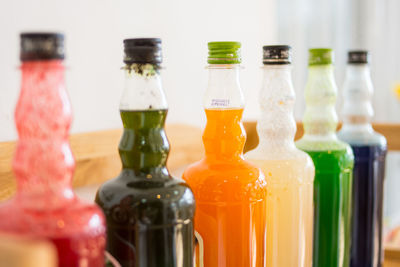 Close-up of wine bottles on table