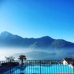 Low angle view of mountain against clear blue sky