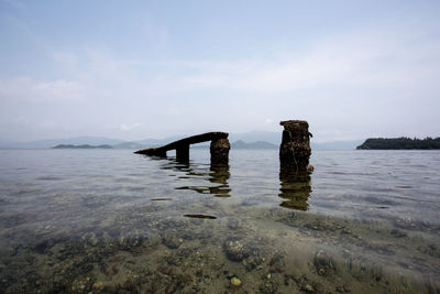 Scenic shot of pier over calm sea