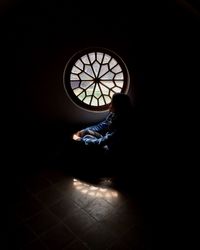 Man sitting in window