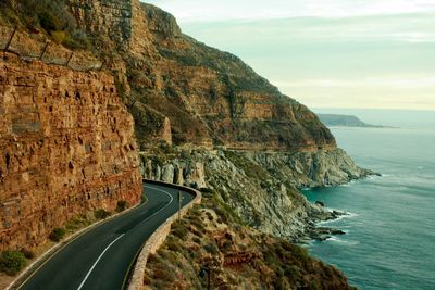 Panoramic view of road by sea against sky