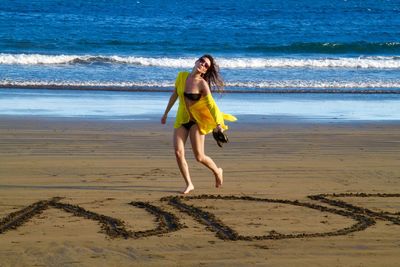 Woman standing on beach