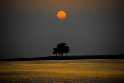 Scenic view of landscape against sky at dusk