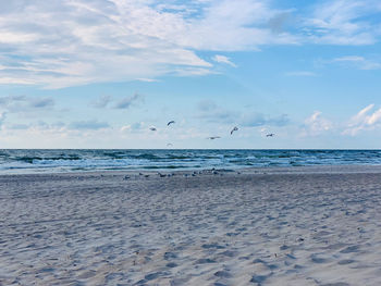 Scenic view of beach against sky