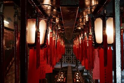 Close-up of illuminated lanterns hanging at night