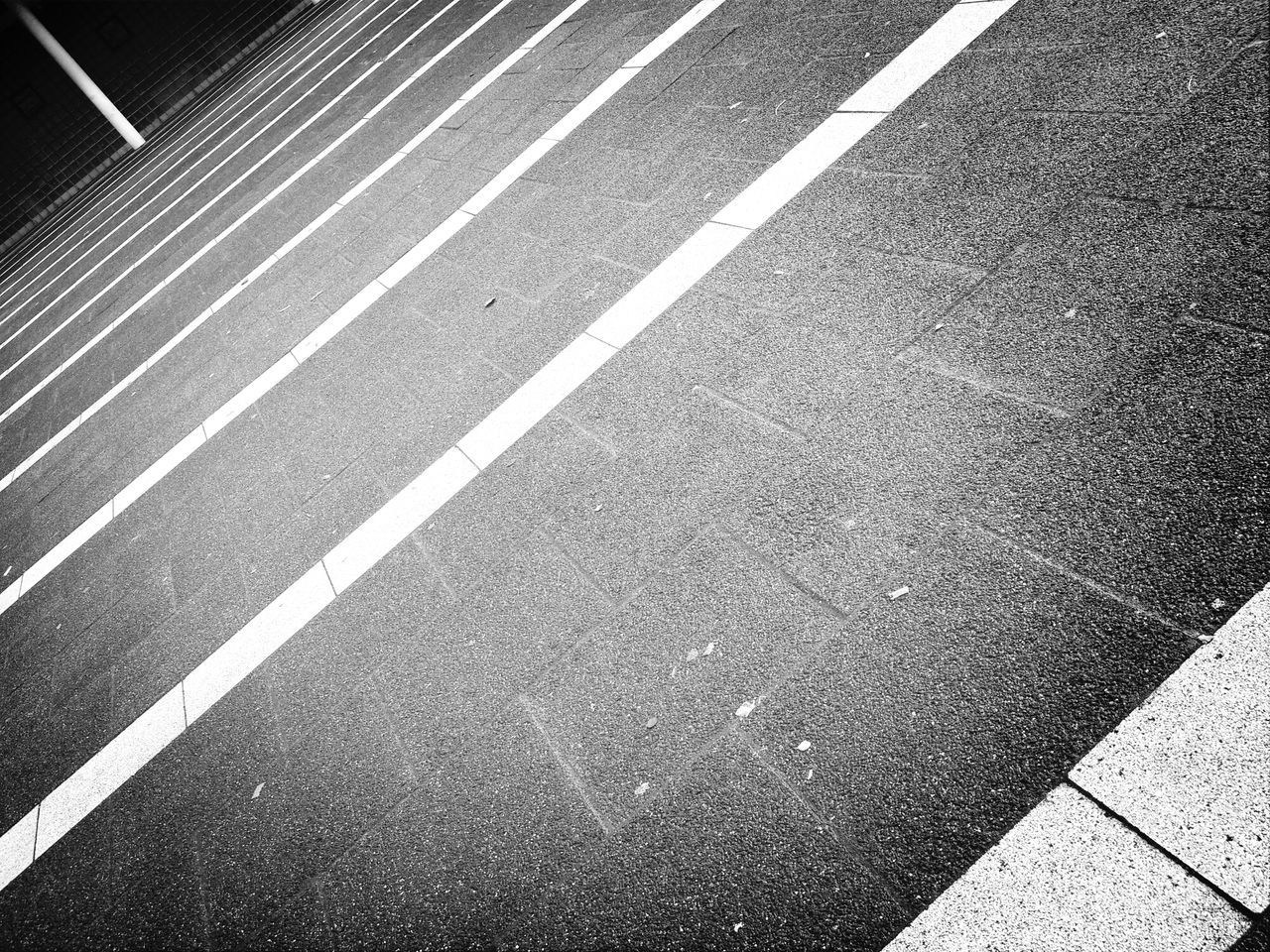 road marking, street, asphalt, transportation, road, high angle view, zebra crossing, the way forward, outdoors, full frame, sidewalk, day, pattern, no people, textured, sunlight, guidance, backgrounds, shadow, direction