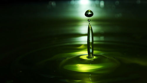 Close-up of drop falling in water