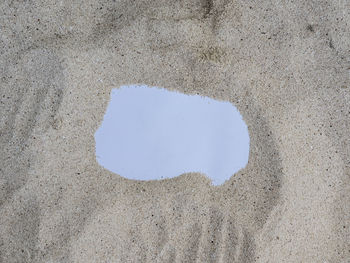 High angle view of beach seen through hole