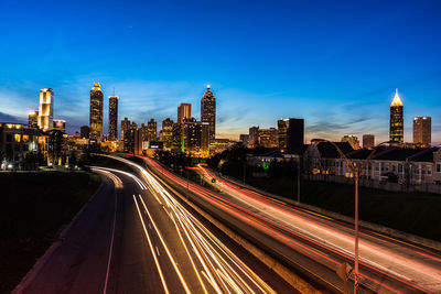 High angle view of light trails on highway at night