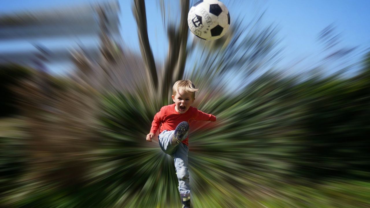 leisure activity, lifestyles, motion, full length, person, fun, young adult, front view, enjoyment, blurred motion, happiness, casual clothing, childhood, mid-air, looking at camera, holding, young women, outdoors