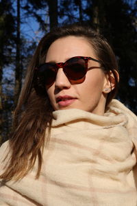 Portrait of young woman in sunglasses