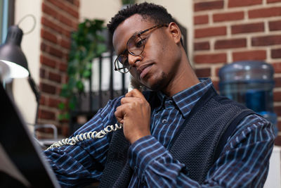 Young man smoking cigarette