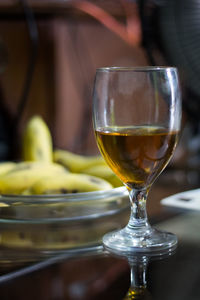 Close-up of wine in glass on table