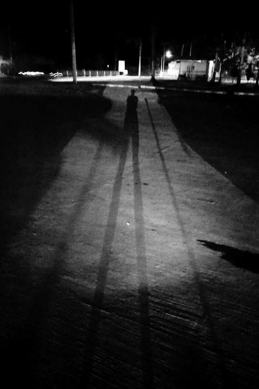 real people, walking, lifestyles, silhouette, men, shadow, outdoors, women, two people, the way forward, illuminated, night, architecture, people