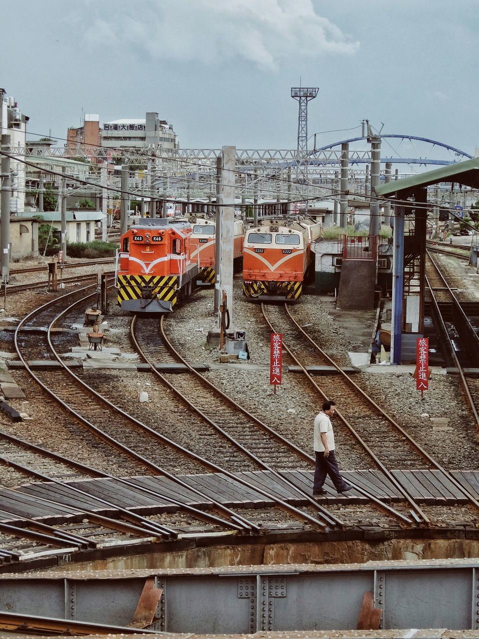 transportation, architecture, men, built structure, mode of transport, real people, occupation, sky, working, building exterior, day, manual worker, one person, outdoors, people