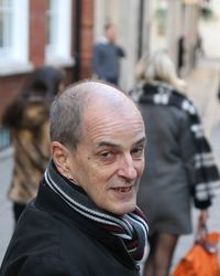 Close-up portrait of senior man in city