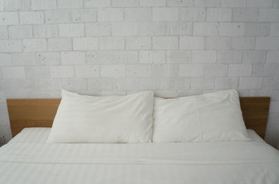 Bed against wall at home