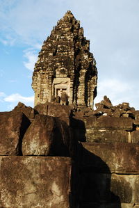 Low angle view of old ruin building against sky