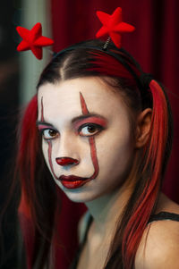 Close-up portrait of young woman with make-up