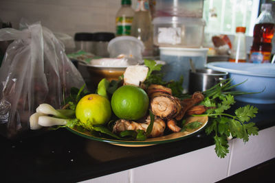 Close-up of fruits in plate on table