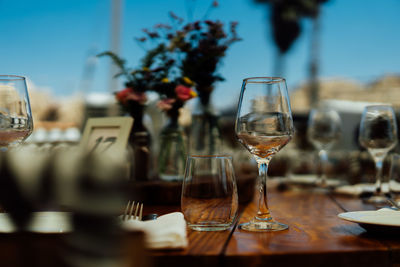 Luxury table settings for fine dining with and glassware, pouring wine to glass. 