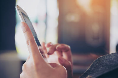 Close-up of woman using mobile phone